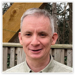 Headshot of Robbie Pearson, Chief Executive Officer (CEO) at HIS. Robbie is standing outdoors. 